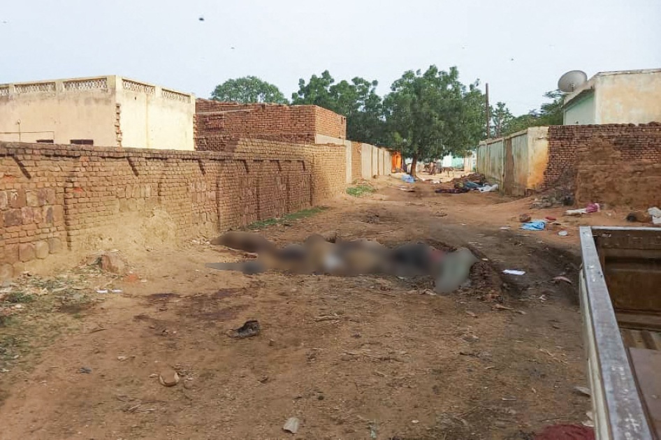 A photo of blurred dead bodies lying in a street